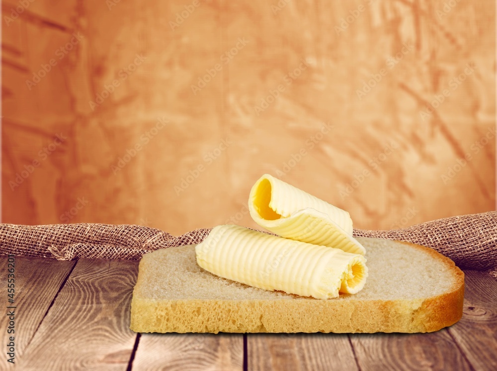 Slice of bread with cream cheese, toast with melted cheese