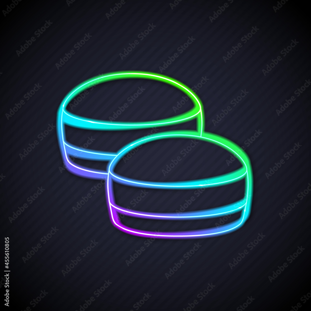 Glowing neon line Macaron cookie icon isolated on black background. Macaroon sweet bakery. Vector