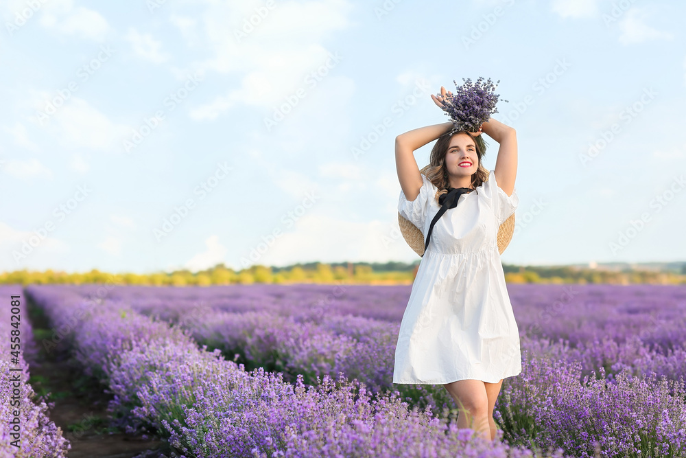 Beautiful young woman in lavender field