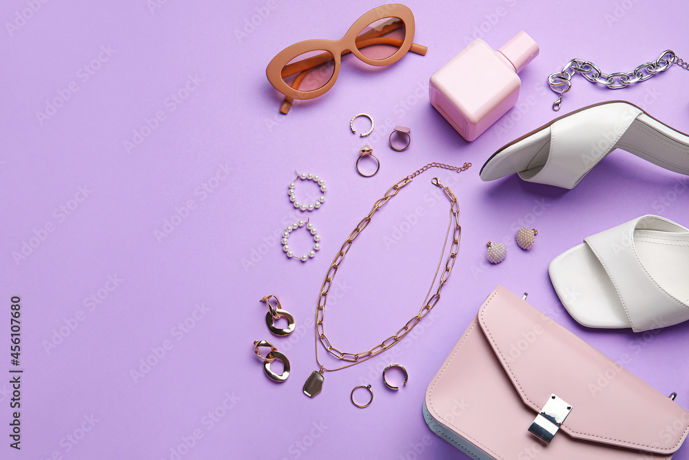 Set of female accessories and shoes on color background, closeup