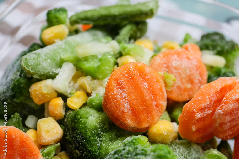 Bowl with different frozen vegetables, closeup