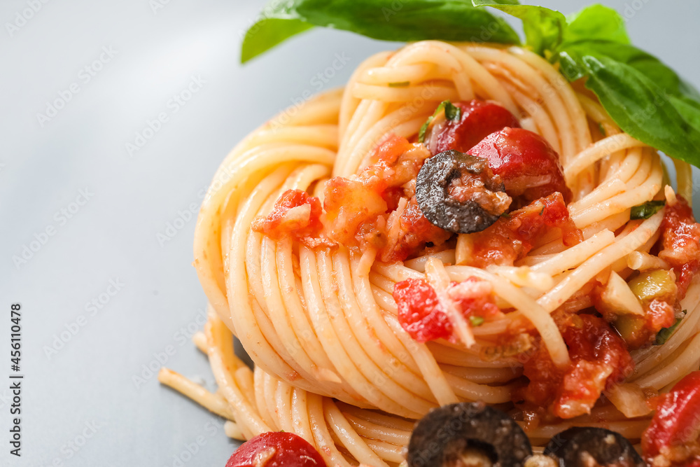 Tasty Pasta Puttanesca on plate, closeup