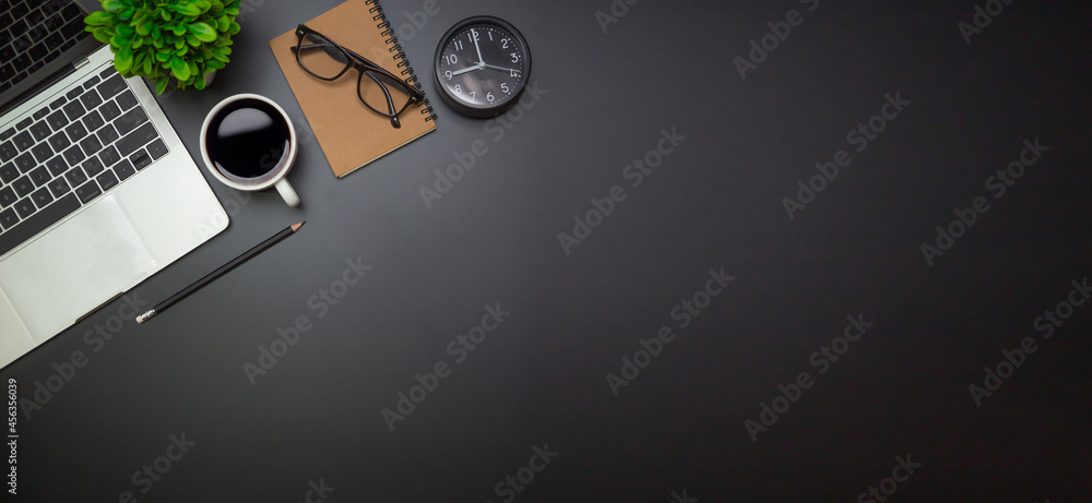 Workspace - Flat top view illustration of a workspace with a coffee cup and notebook on the black de