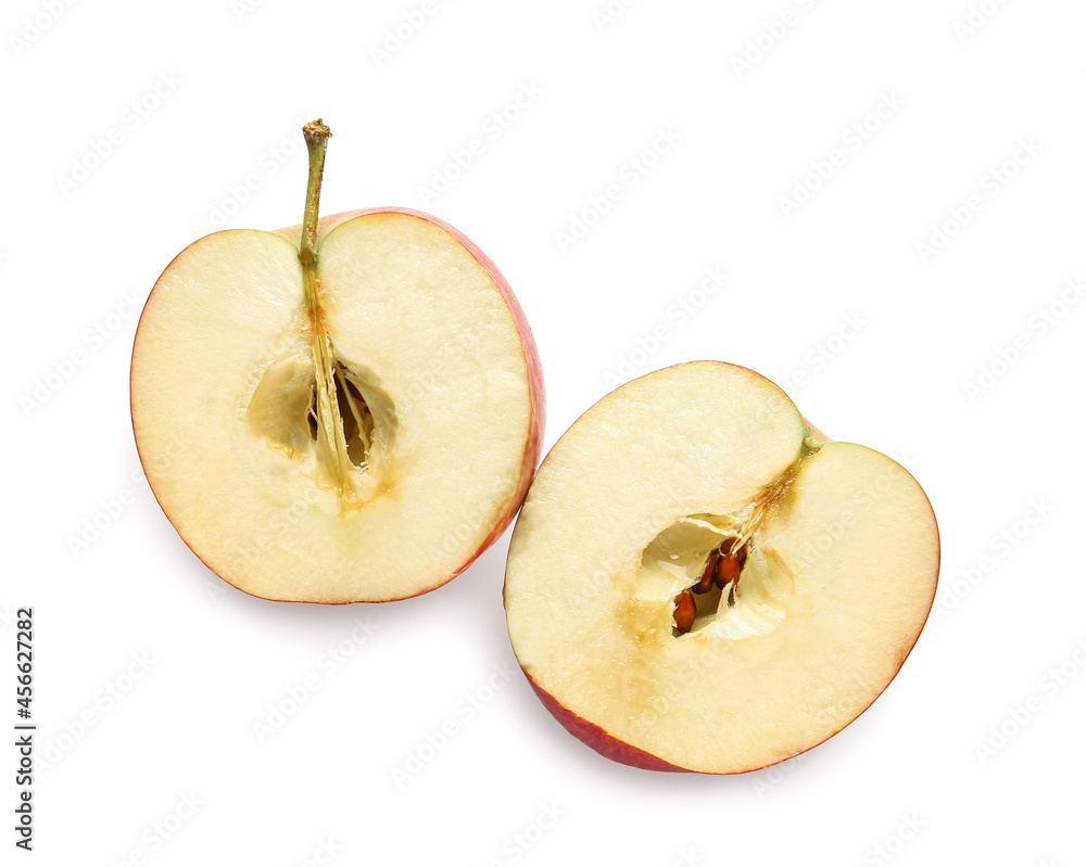 Halves of ripe apple on white background