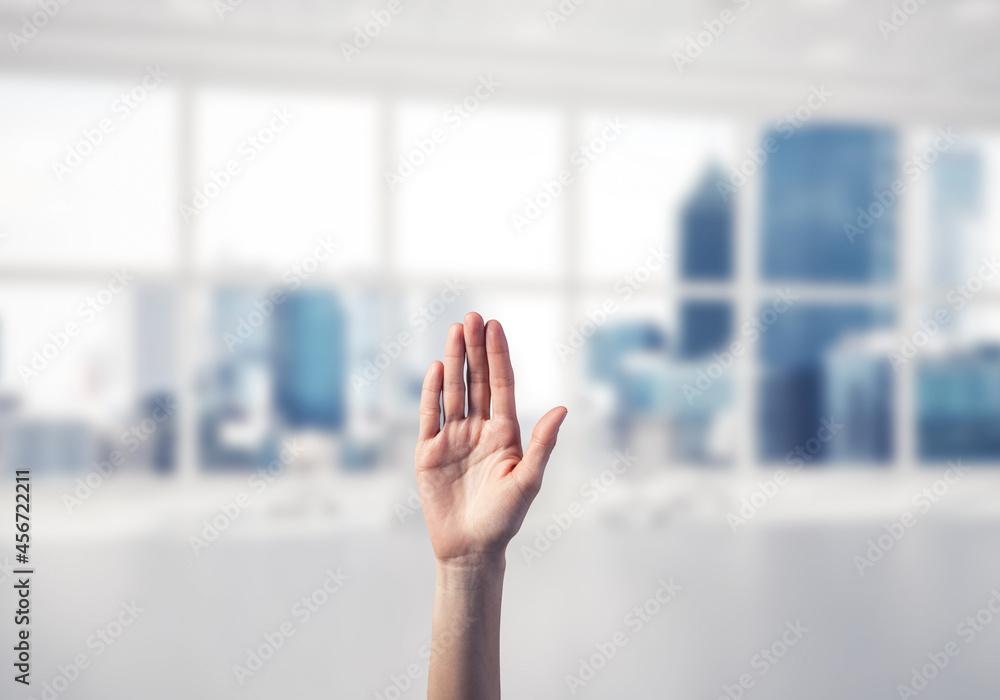 Choosing gesture of person in elegant modern interior in sunshine light