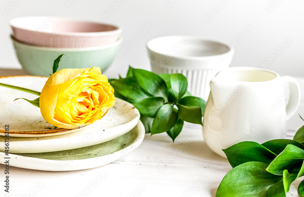 ceramic tableware with flowers on white background