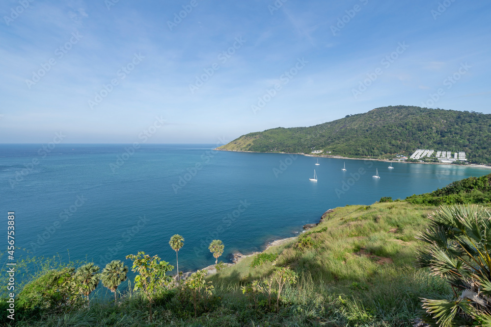 High angle view Tropical sea with wave crashing on seashore and high mountain located in Phuket Thai