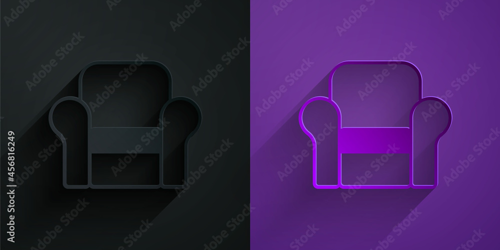 Paper cut Armchair icon isolated on black on purple background. Paper art style. Vector