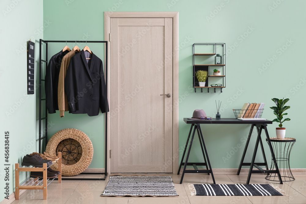 Interior of stylish hallway with soft rug