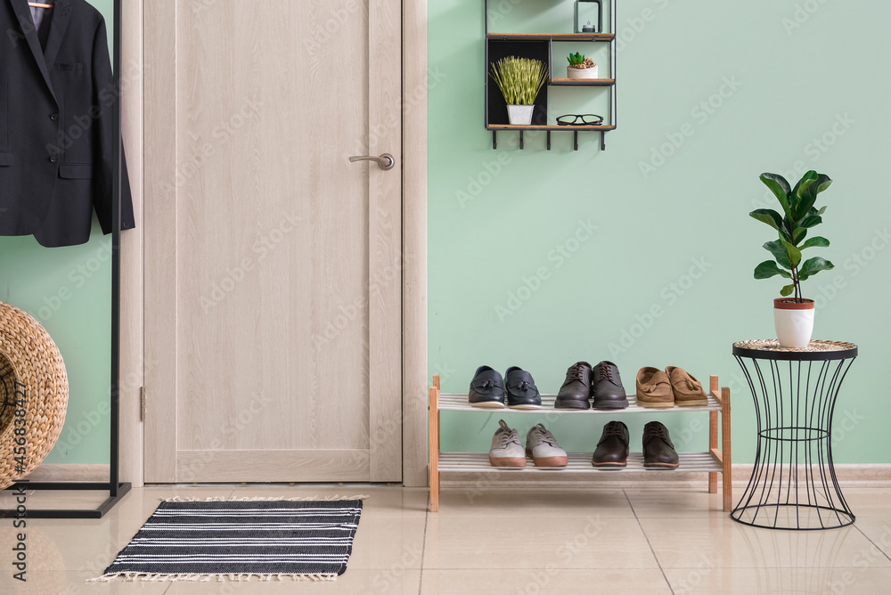 Interior of stylish hallway with soft rug