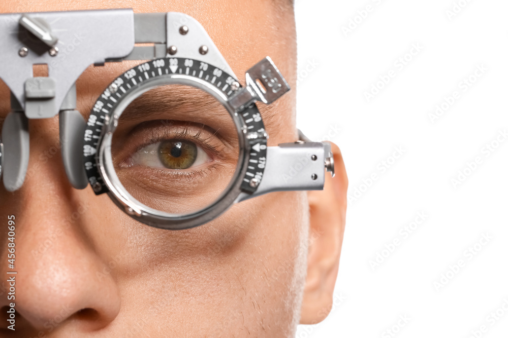 Young man undergoing eye test, closeup