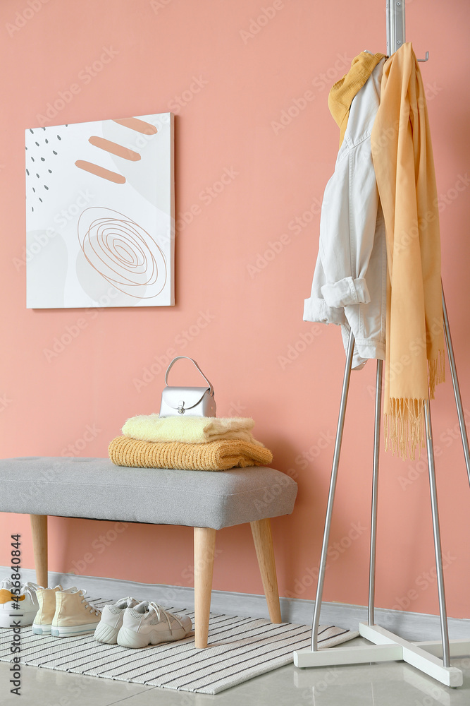 Interior of stylish hallway with hanger