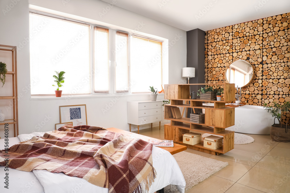 Interior of stylish bedroom with bathtub