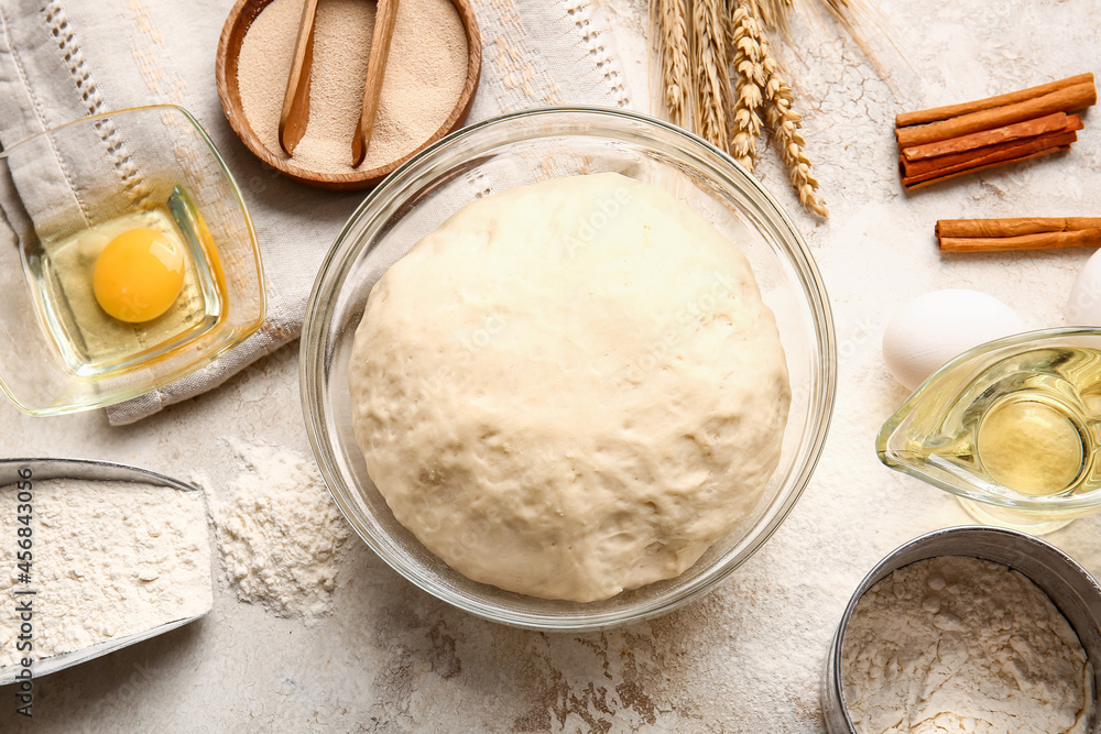 Composition with fresh dough on light background