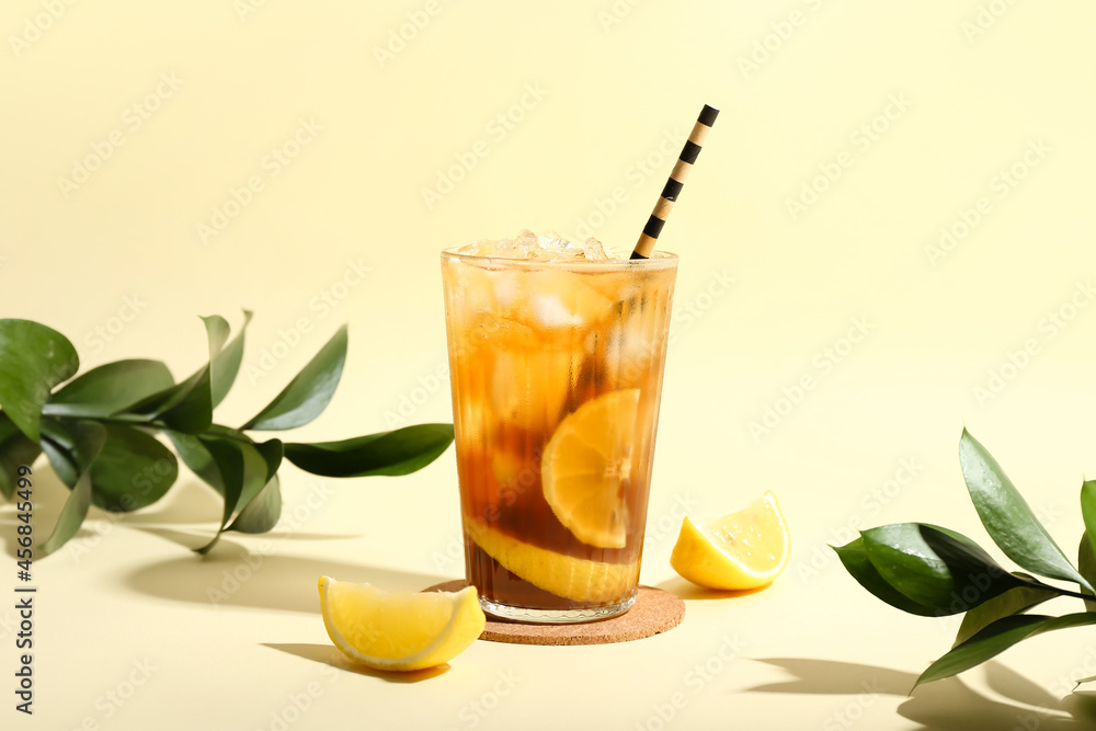 Glass of tasty Long Island iced tea on color background