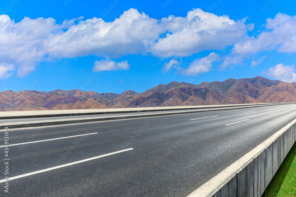 Highway ground and mountain natural scenery under blue sky.Landscape and highway.Outdoor road backgr