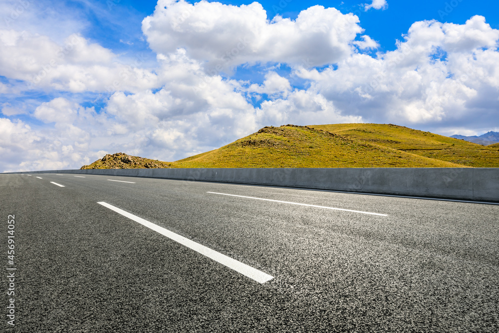 Highway ground and mountain natural scenery under blue sky.Landscape and highway.Outdoor road backgr