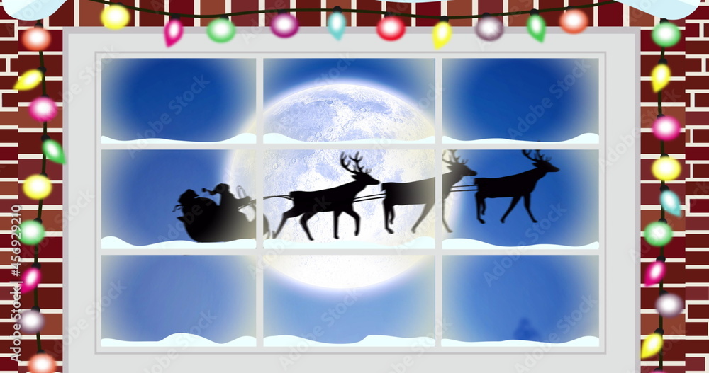 Digital image of fairy light on wooden fame against black silhouette of santa claus in sleigh be