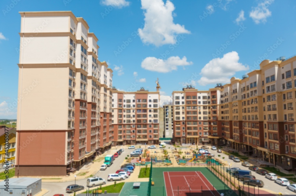 City courtyard or street with cars and playgrounds for children and walks.