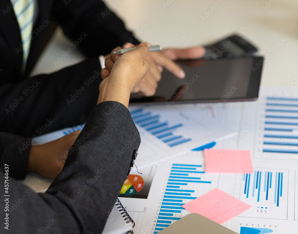 Businessmen discuss strategy analysis and business planning.