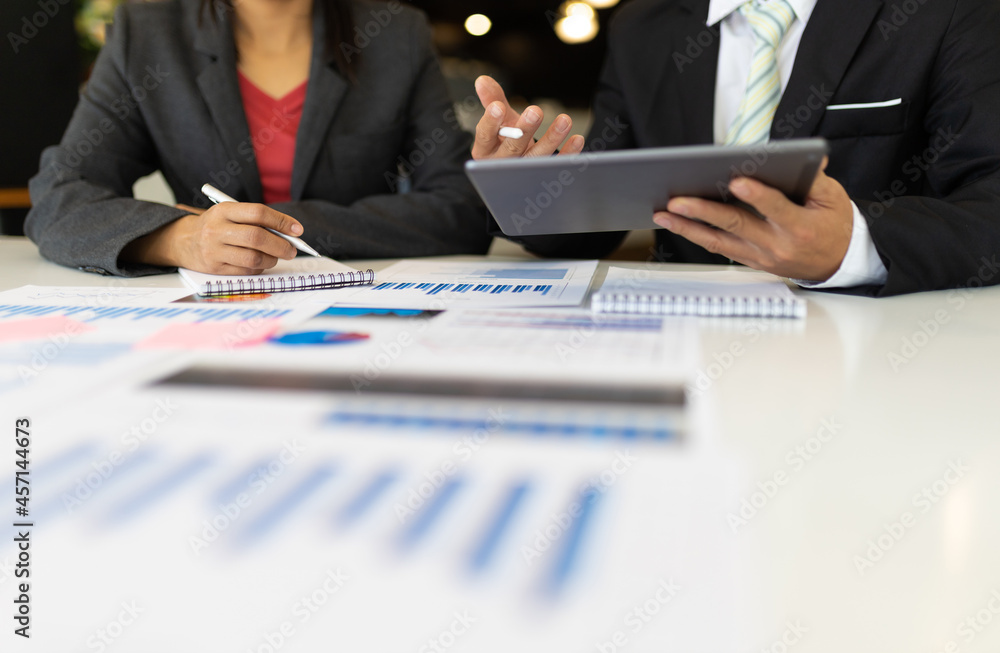 Businessmen discuss strategy analysis and business planning.