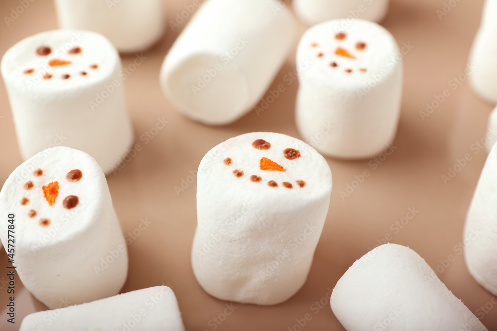 Plate with snowmen made of soft marshmallows, closeup