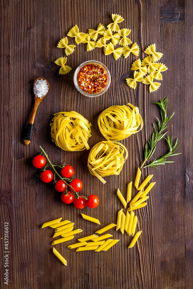 Fettuccine pasta with ingredients - tomatoes olive oil and herbs