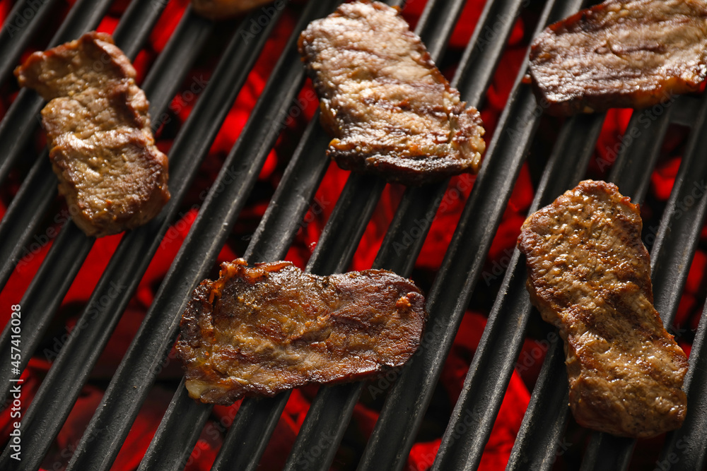 Tasty beef brisket on barbecue grill