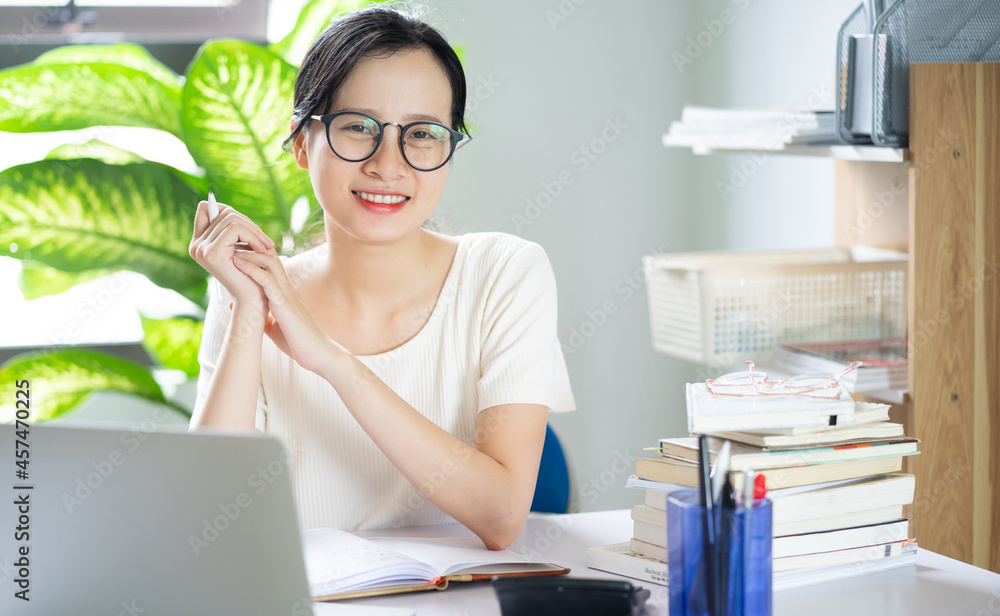 Asian young girl doing homework