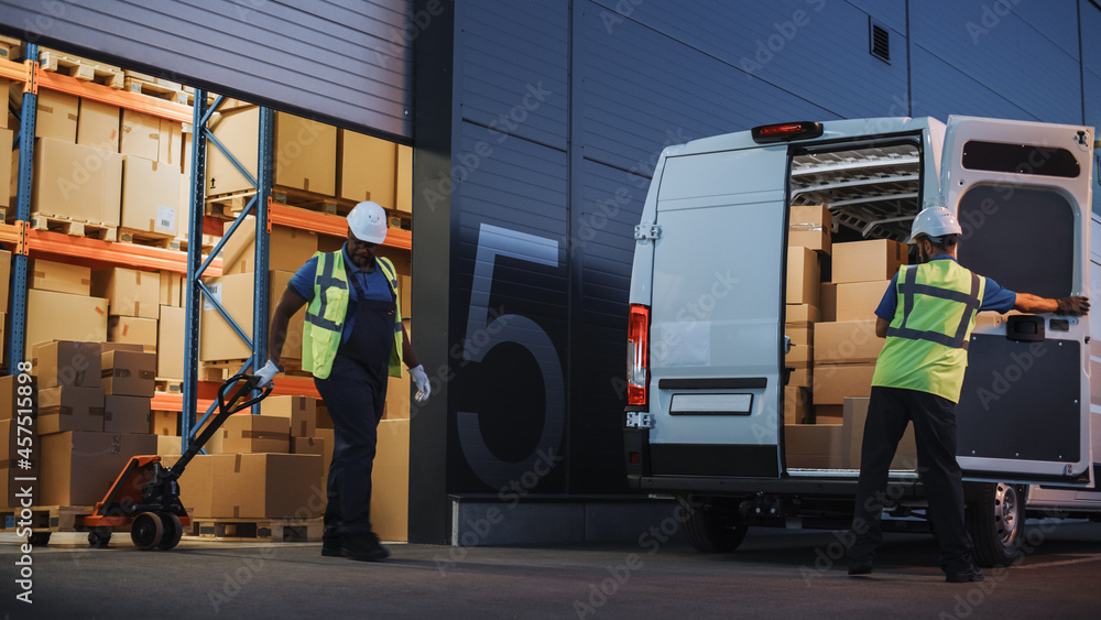 Logistics Warehouse Two Happy Workers Talk, Joke use Hand Pallet Truck Start Loading Delivery Truck 