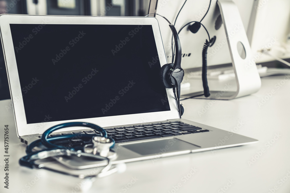 Headset and doctor equipment at clinic ready for actively support for patient by online video call .