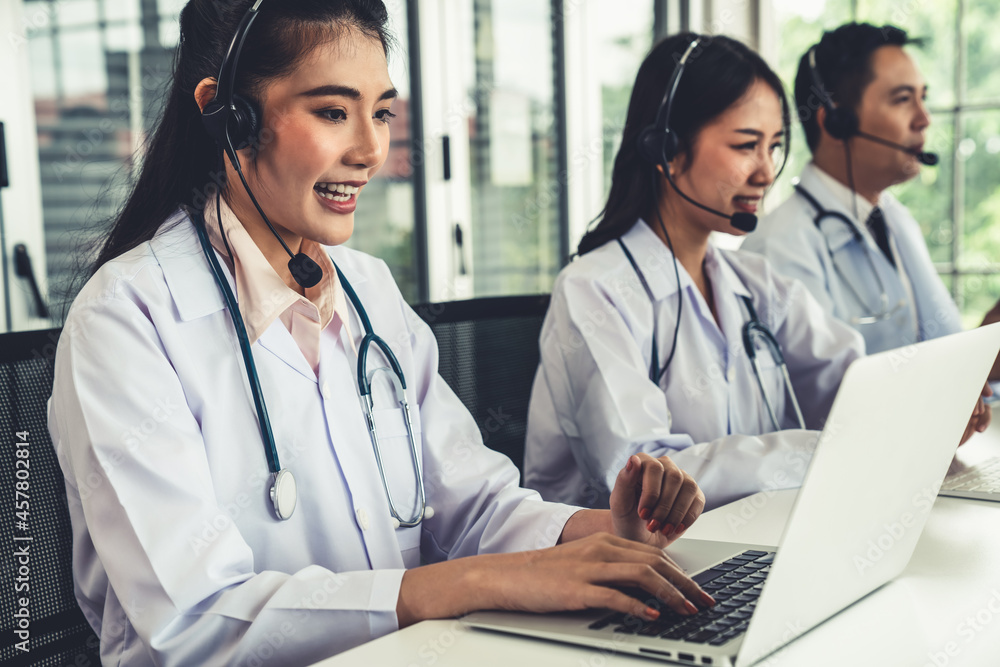 Doctor team wearing headset talking actively on video call in hospital clinic . Concept of telehealt