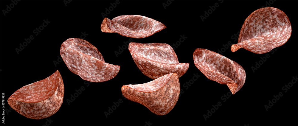 Falling salami slices isolated on black background