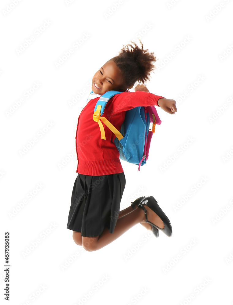 Jumping African-American schoolgirl on white background