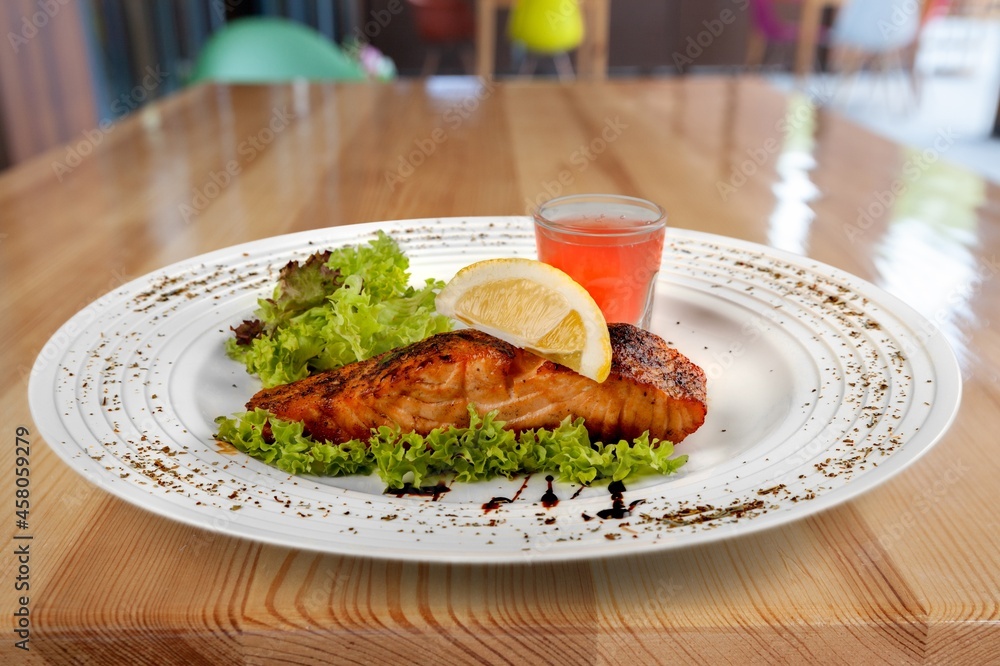 Traditional food tasty fish with vegetables on a plate