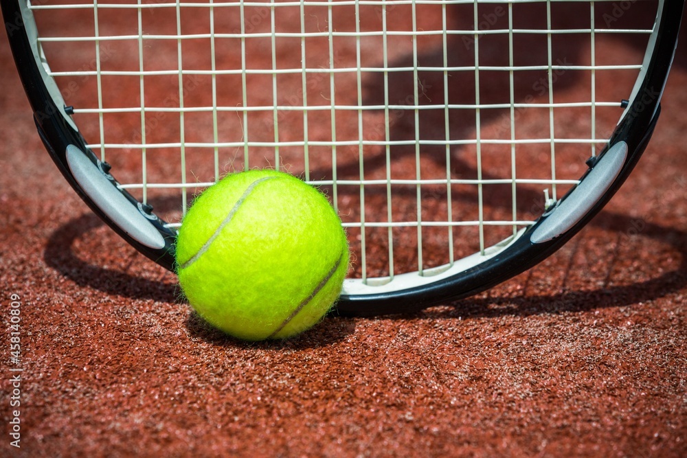 Tennis Ball and Racket on the Court