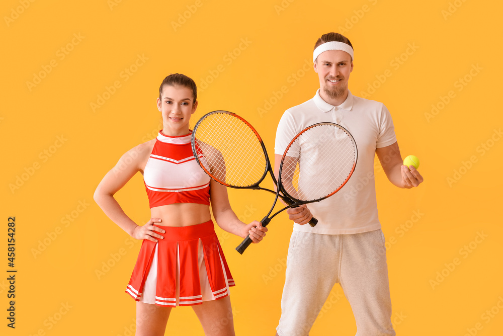 Cheerleader and tennis player on color background