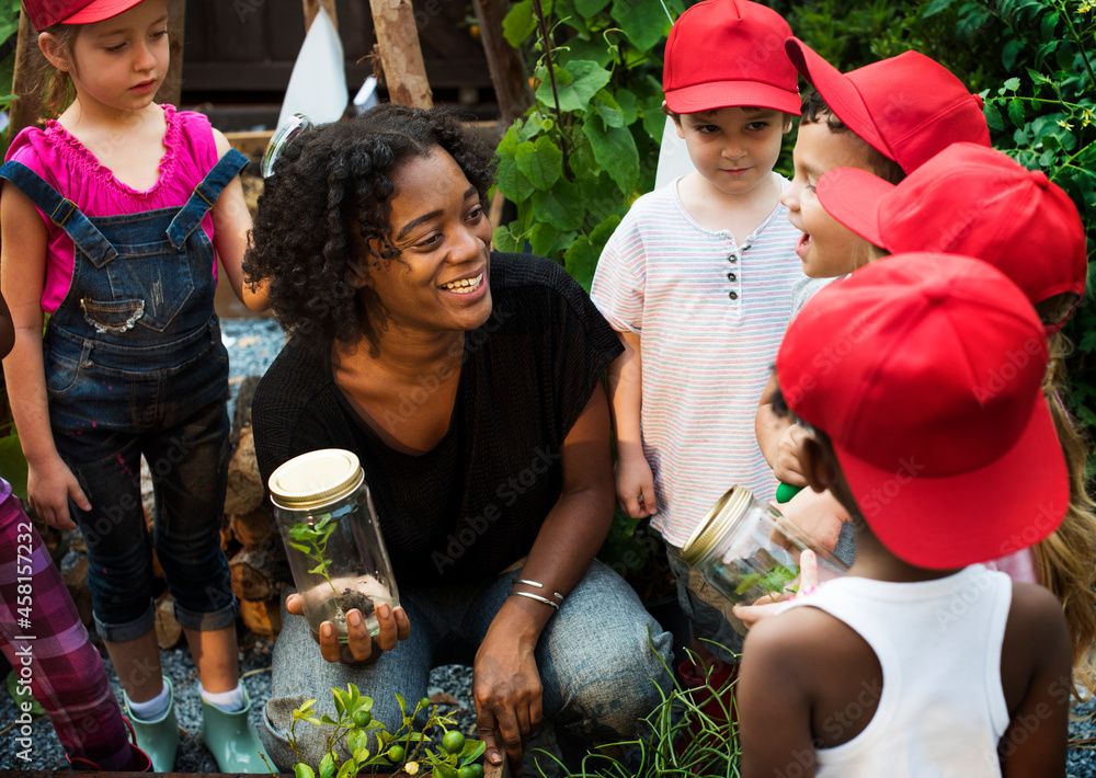 Teacher and kids having fun learning about plants