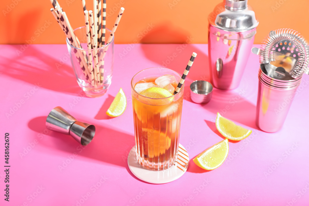 Glass of tasty Long Island iced tea on color background