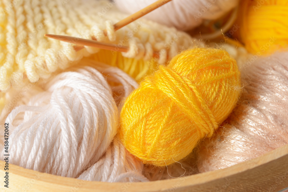 Knitting yarn and needles as background, closeup