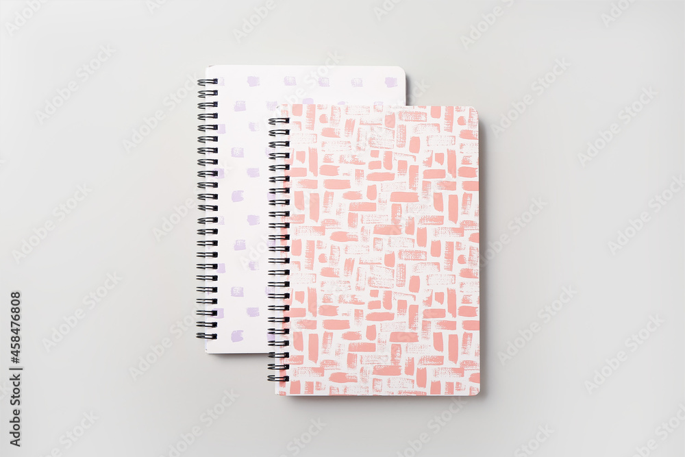 Stylish notebooks on white background