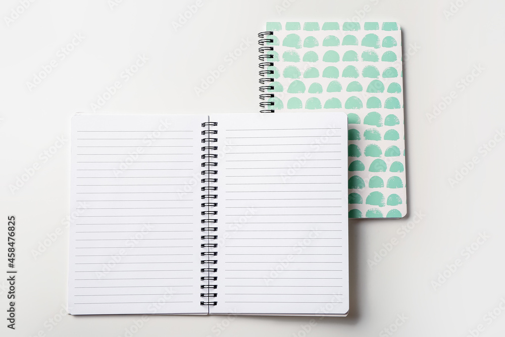 Stylish notebooks on white background