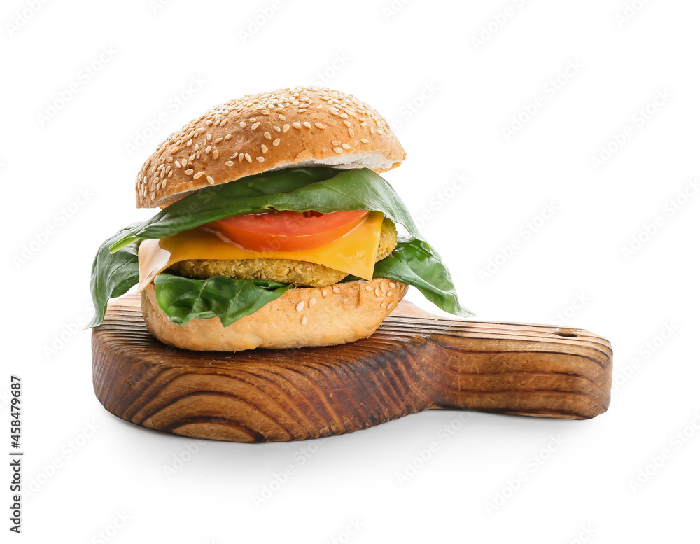 Wooden board with tasty vegetarian burger on white background