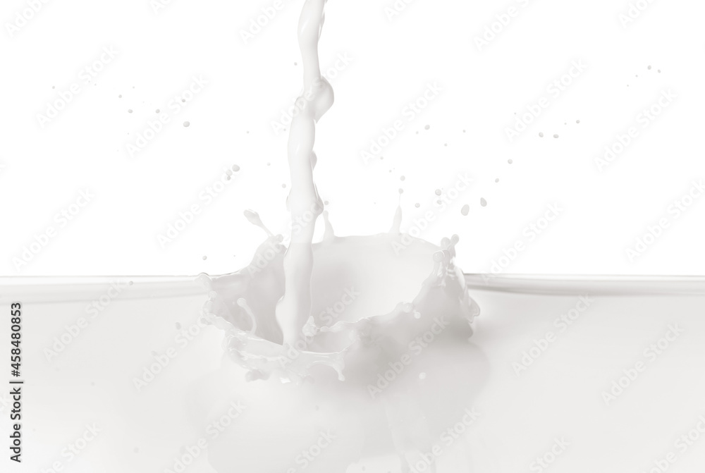 Pouring delicious milk on white background