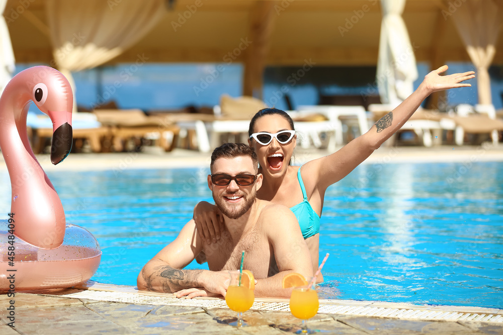 Young couple in swimming pool