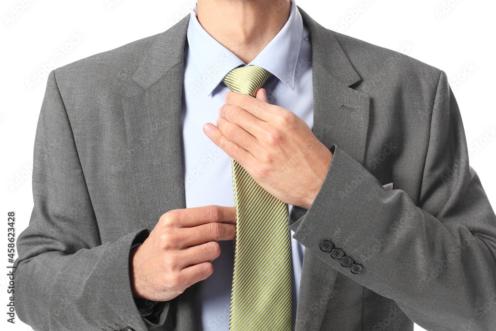 Young man in stylish suit on white background