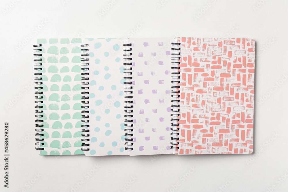 Stylish notebooks on white background