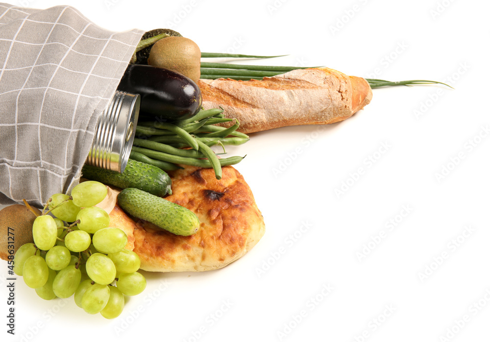 Eco bag with fruits, vegetables and bakery on white background, closeup