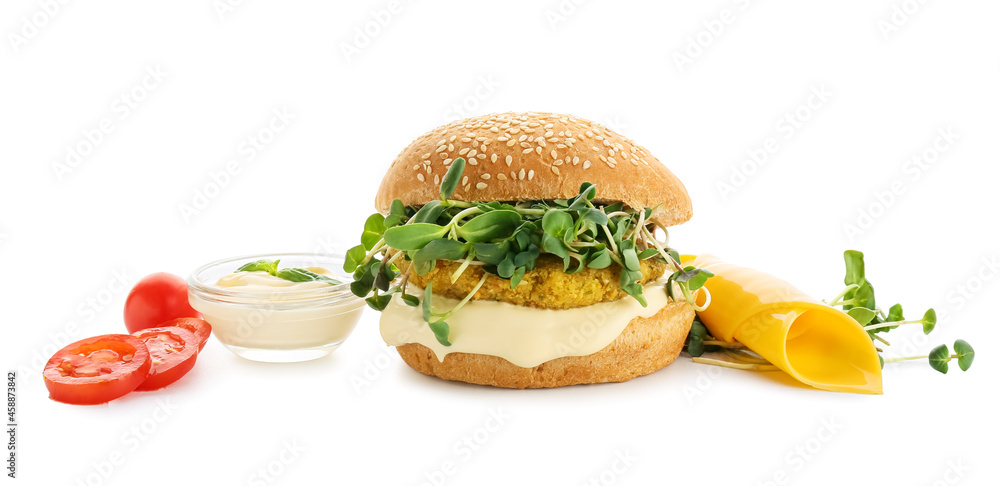 Tasty vegetarian burger and ingredients on white background