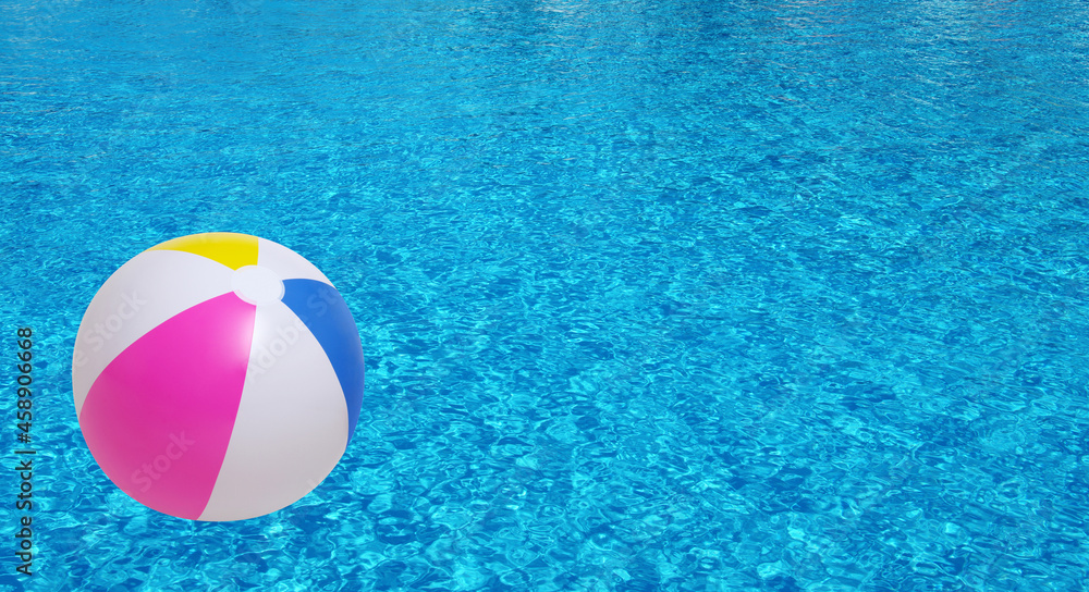 Beach ball in swimming pool